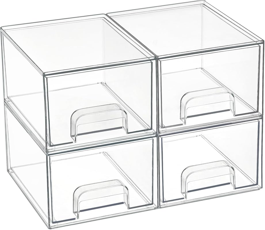 Four small clear stackable storage drawers for makeup, vanity, and pan